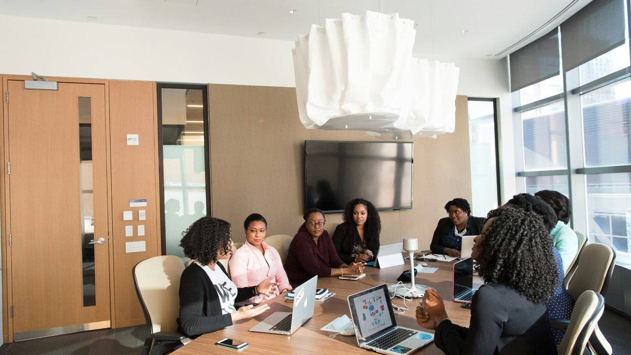 A full advisory board in session around the table